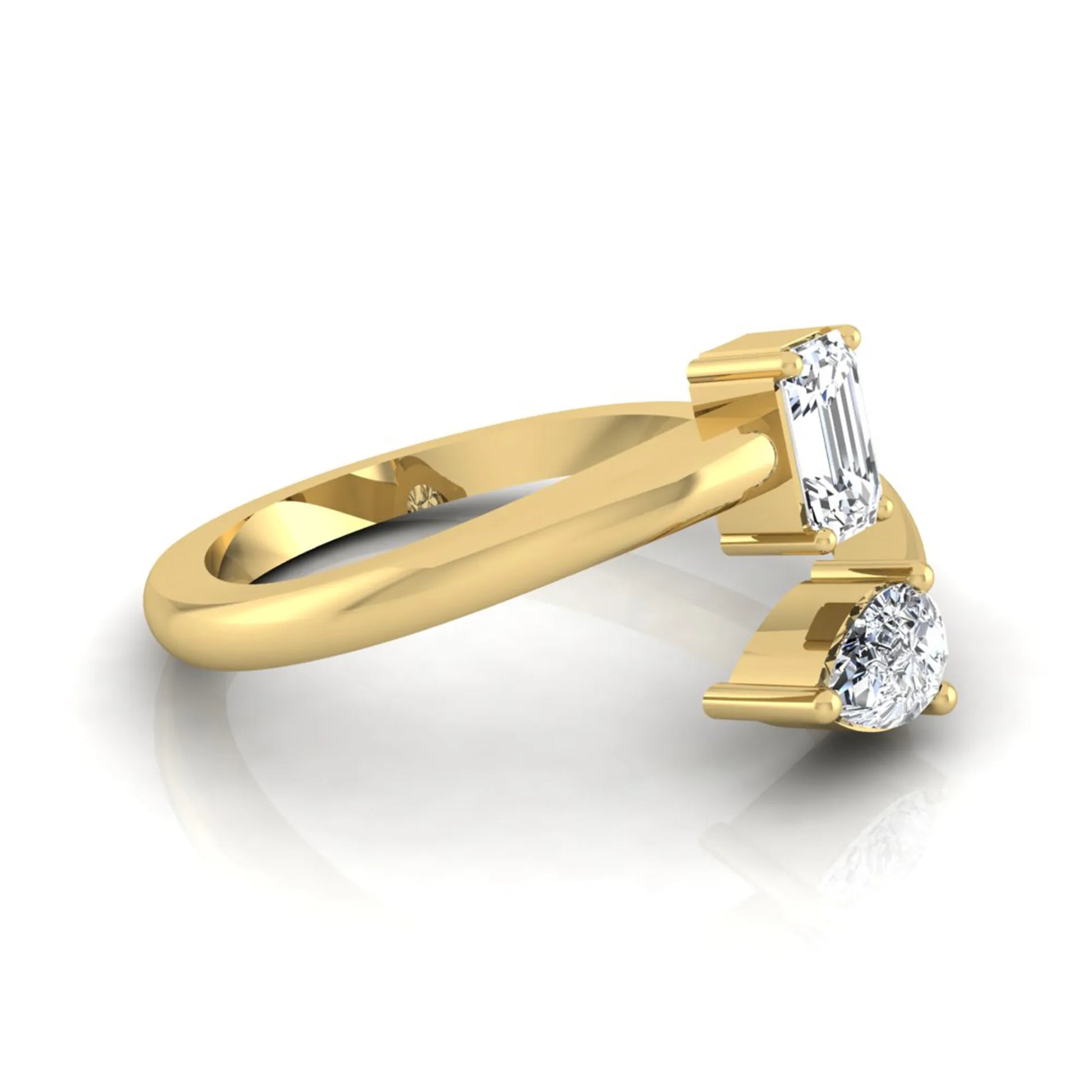 Emerald and pear cut lab grown diamond Toi et Moi ring featuring a minimalist open design in yellow gold