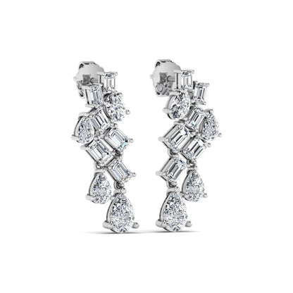 Emerald, pear, and oval cut prong set lab grown diamond drop earrings featuring a cascading multi-shape design in a white gold finish with push back closure.