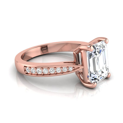 Emerald cut lab grown diamond engagement ring featuring a four-prong setting with round diamond accent band in a rose gold style design.