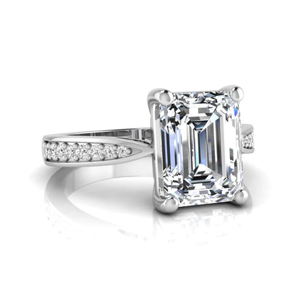 Emerald cut lab grown diamond engagement ring featuring a four-prong setting with round diamond accent band in a white gold style design.