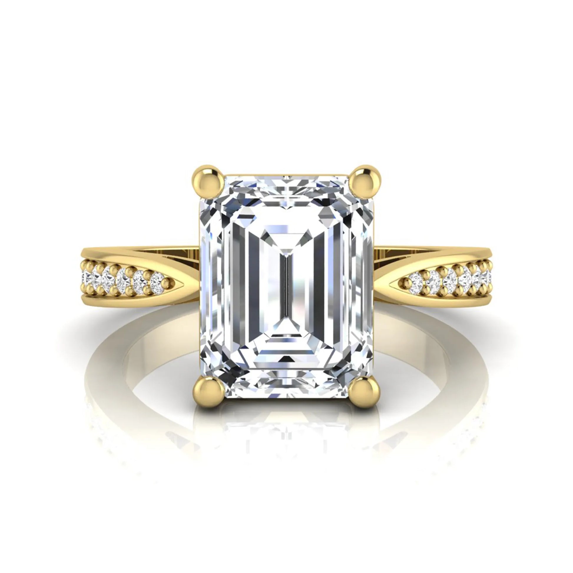 Emerald cut lab grown diamond engagement ring featuring a four-prong setting with round diamond accent band in a yellow gold style design.