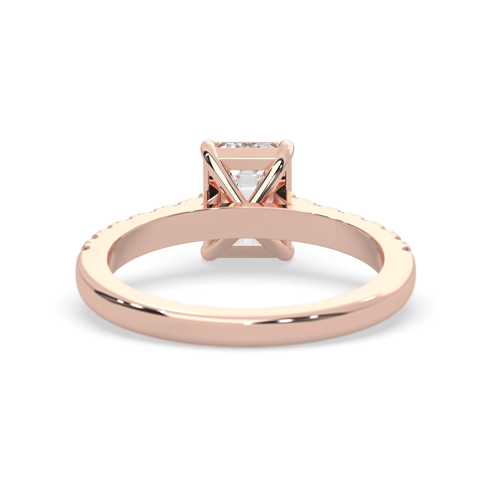 emerald cut lab grown diamond prong set engagement ring with pavé band and rose gold  metal tone design