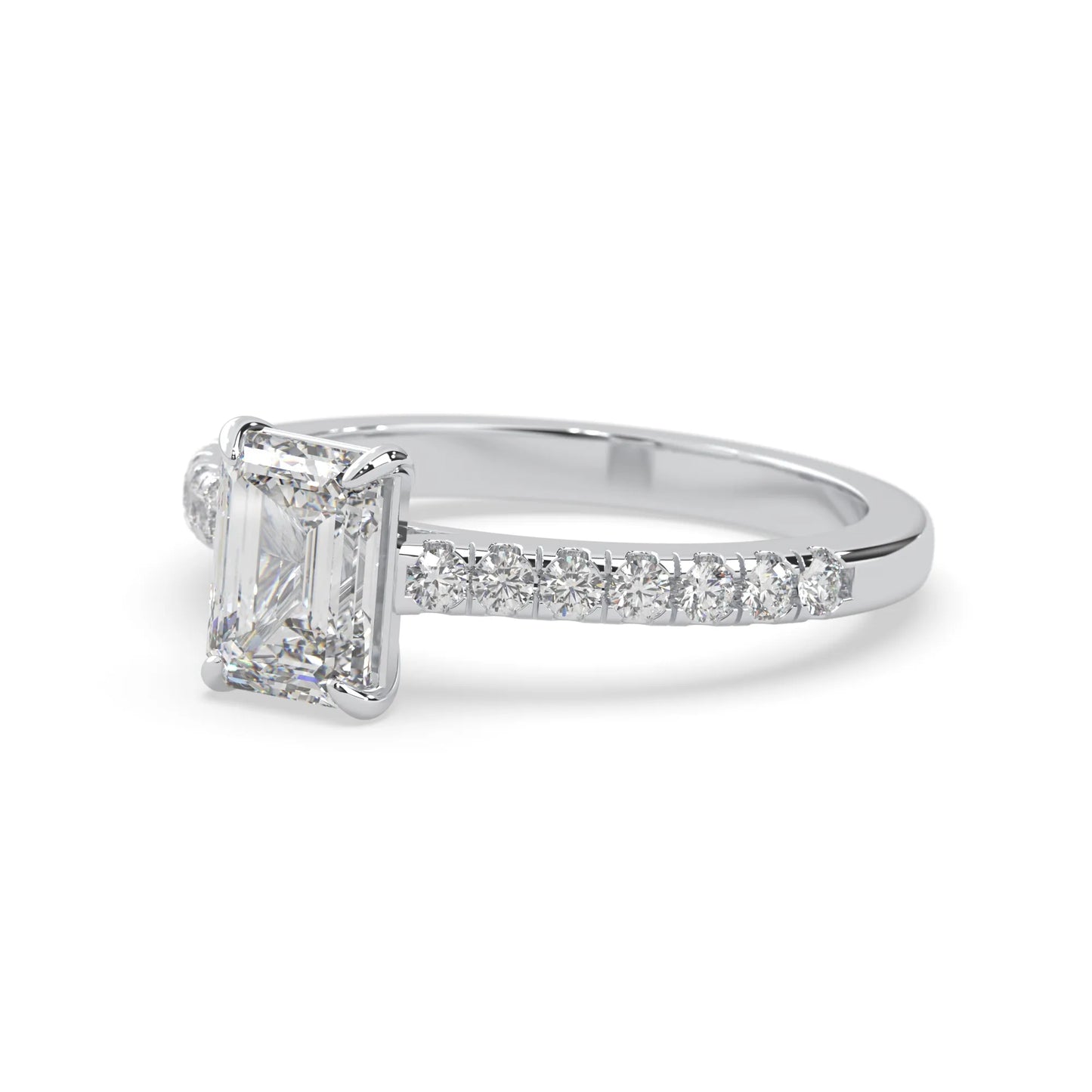 emerald cut lab grown diamond prong set engagement ring with pavé band and white gold  metal tone design