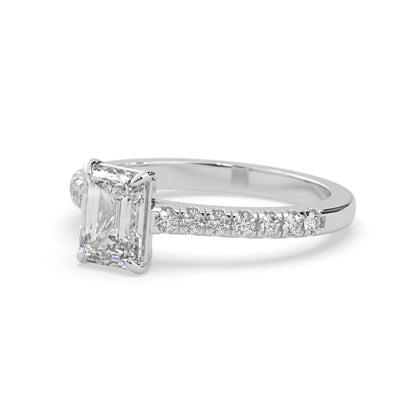 emerald cut lab grown diamond prong set engagement ring with pavé band and white gold  metal tone design