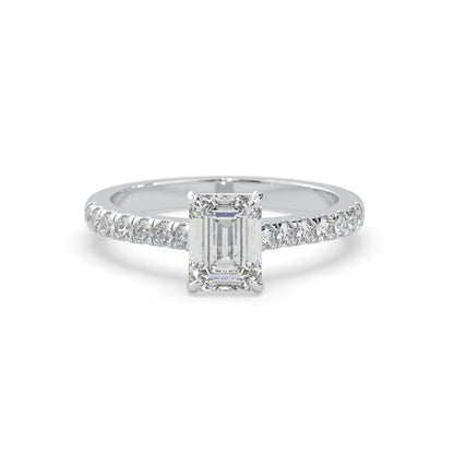 emerald cut lab grown diamond prong set engagement ring with pavé band and white gold  metal tone design