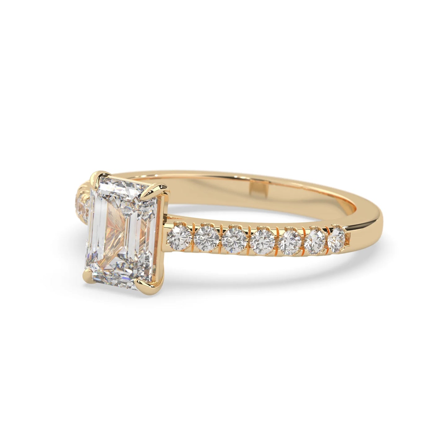 emerald cut lab grown diamond prong set engagement ring with pavé band and yellow gold  metal tone design