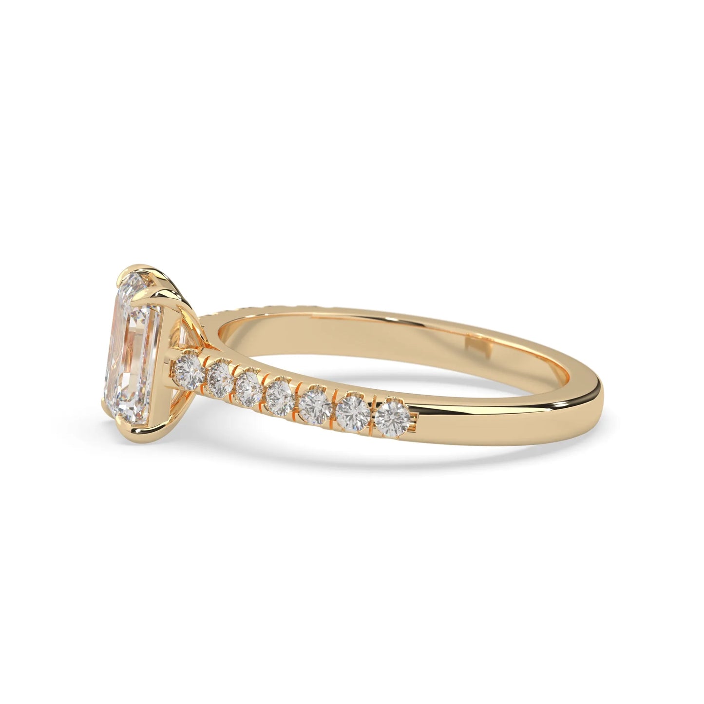 emerald cut lab grown diamond prong set engagement ring with pavé band and yellow gold  metal tone design