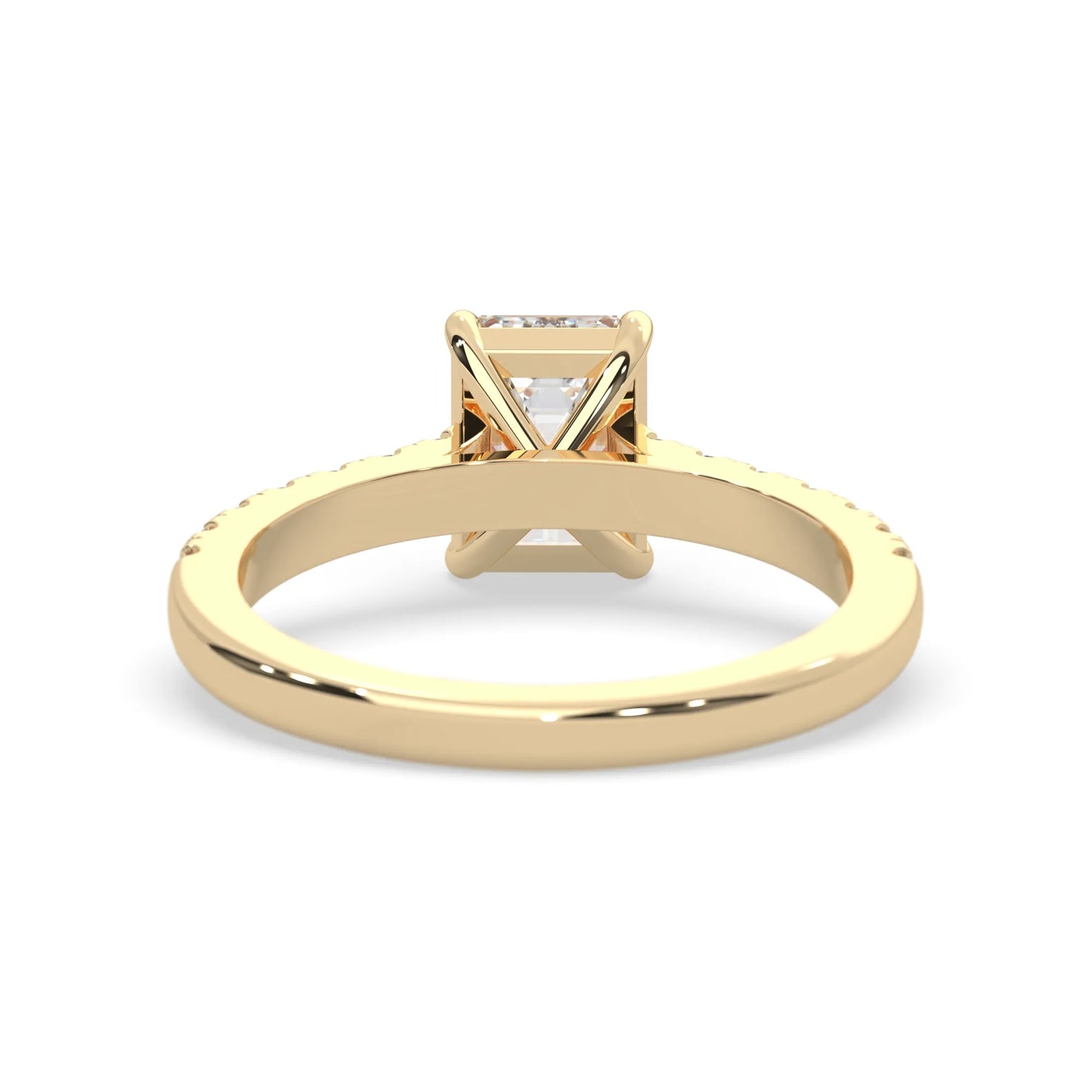 emerald cut lab grown diamond prong set engagement ring with pavé band and yellow gold  metal tone design