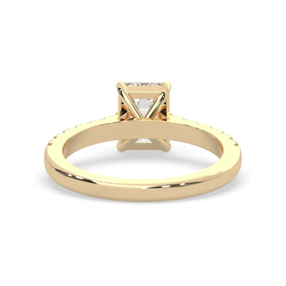 emerald cut lab grown diamond prong set engagement ring with pavé band and yellow gold  metal tone design
