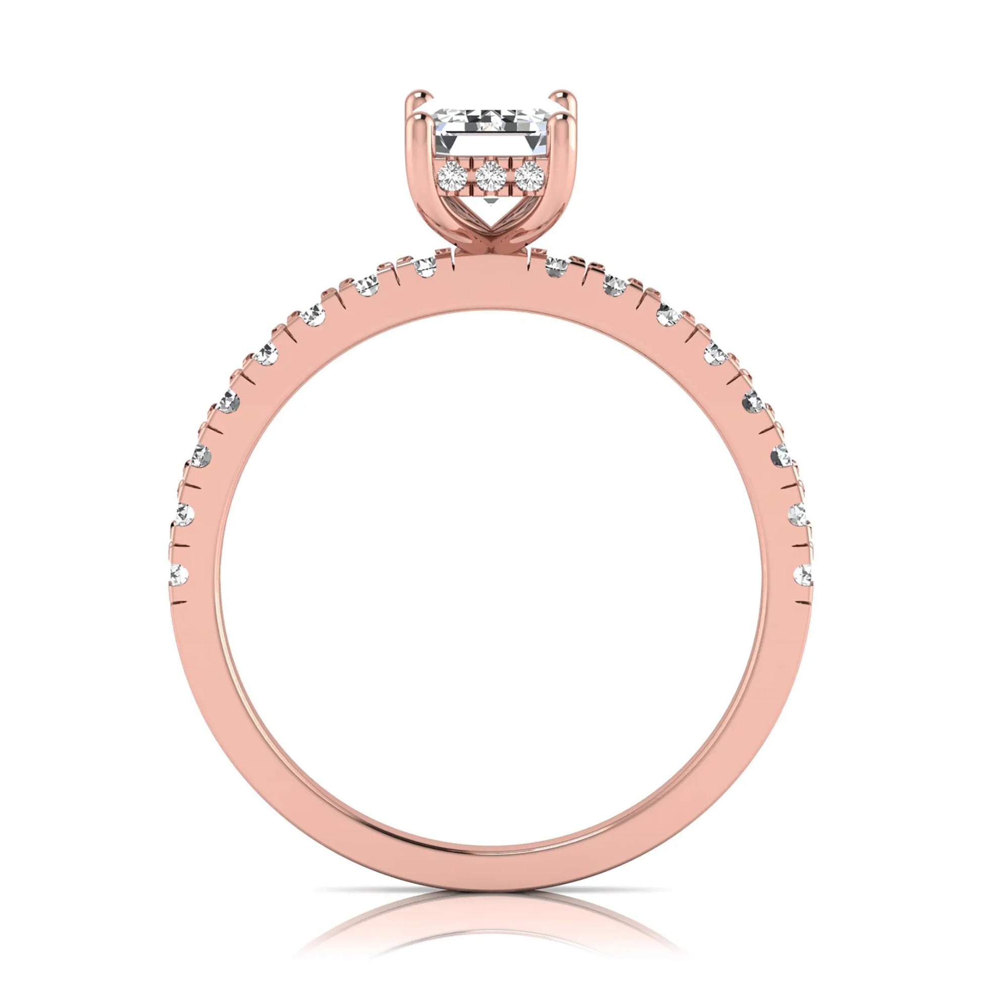Emerald cut lab grown diamond solitaire ring with round pavé side stones in a four-prong setting and polished rose gold finish.