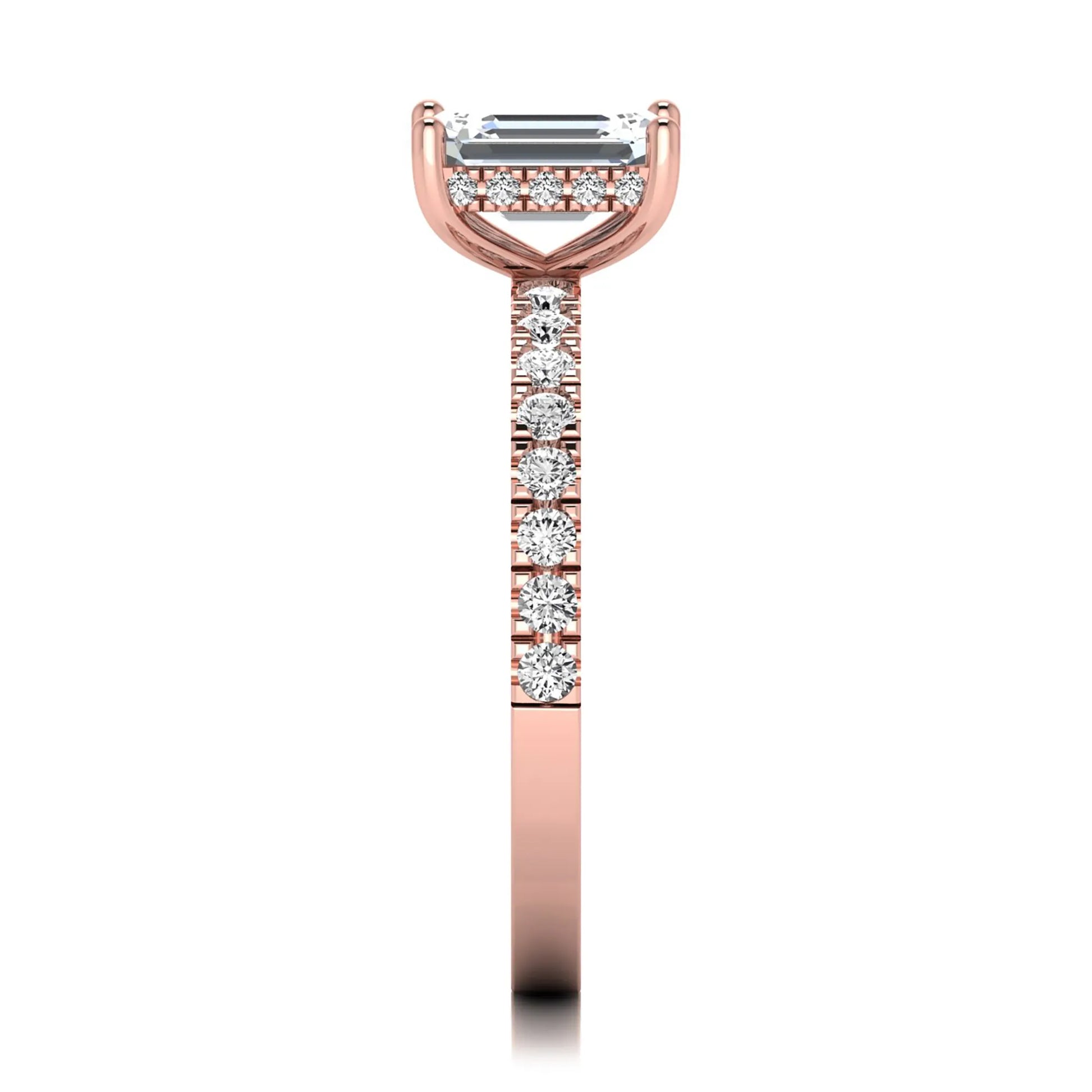 Emerald cut lab grown diamond solitaire ring with round pavé side stones in a four-prong setting and polished rose gold finish.