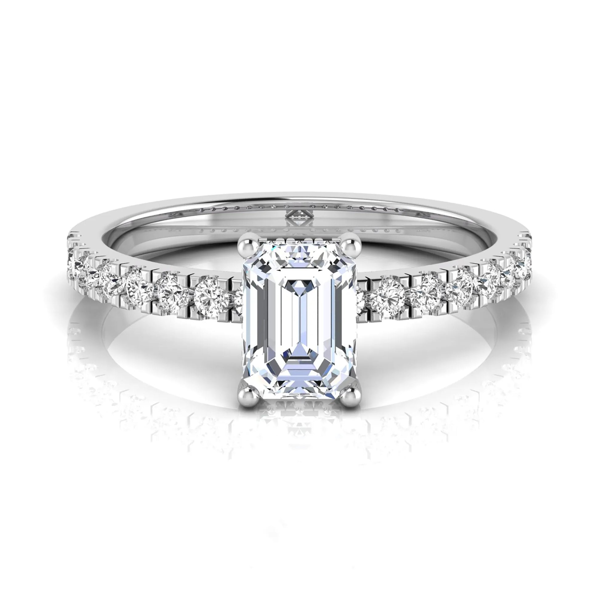 Emerald cut lab grown diamond solitaire ring with round pavé side stones in a four-prong setting and polished white gold finish.