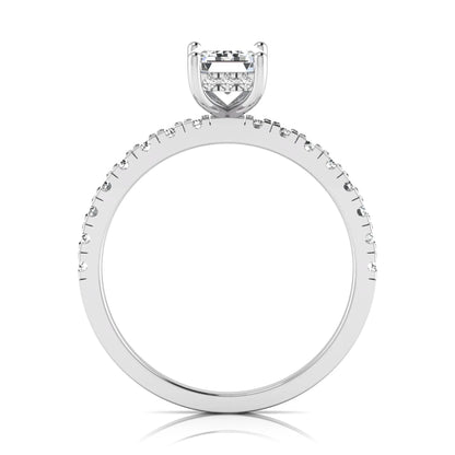Emerald cut lab grown diamond solitaire ring with round pavé side stones in a four-prong setting and polished white gold finish.