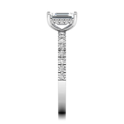 Emerald cut lab grown diamond solitaire ring with round pavé side stones in a four-prong setting and polished white gold finish.