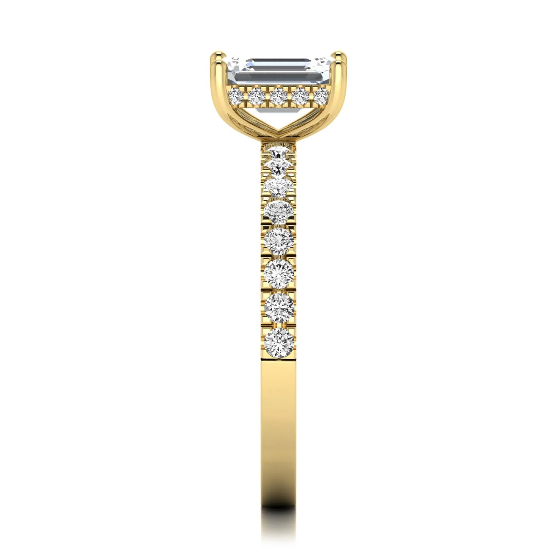 Emerald cut lab grown diamond solitaire ring with round pavé side stones in a four-prong setting and polished yellow gold finish.