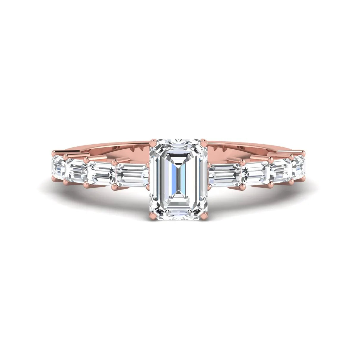 Emerald cut lab grown diamond engagement ring with baguette side diamonds in a four-prong solitaire accent setting and rose gold tone band.