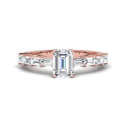 Emerald cut lab grown diamond engagement ring with baguette side diamonds in a four-prong solitaire accent setting and rose gold tone band.
