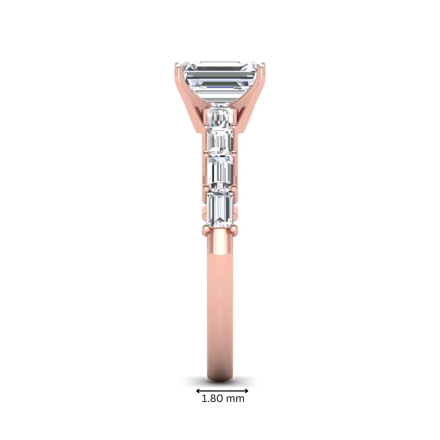Emerald cut lab grown diamond engagement ring with baguette side diamonds in a four-prong solitaire accent setting and rose gold tone band.