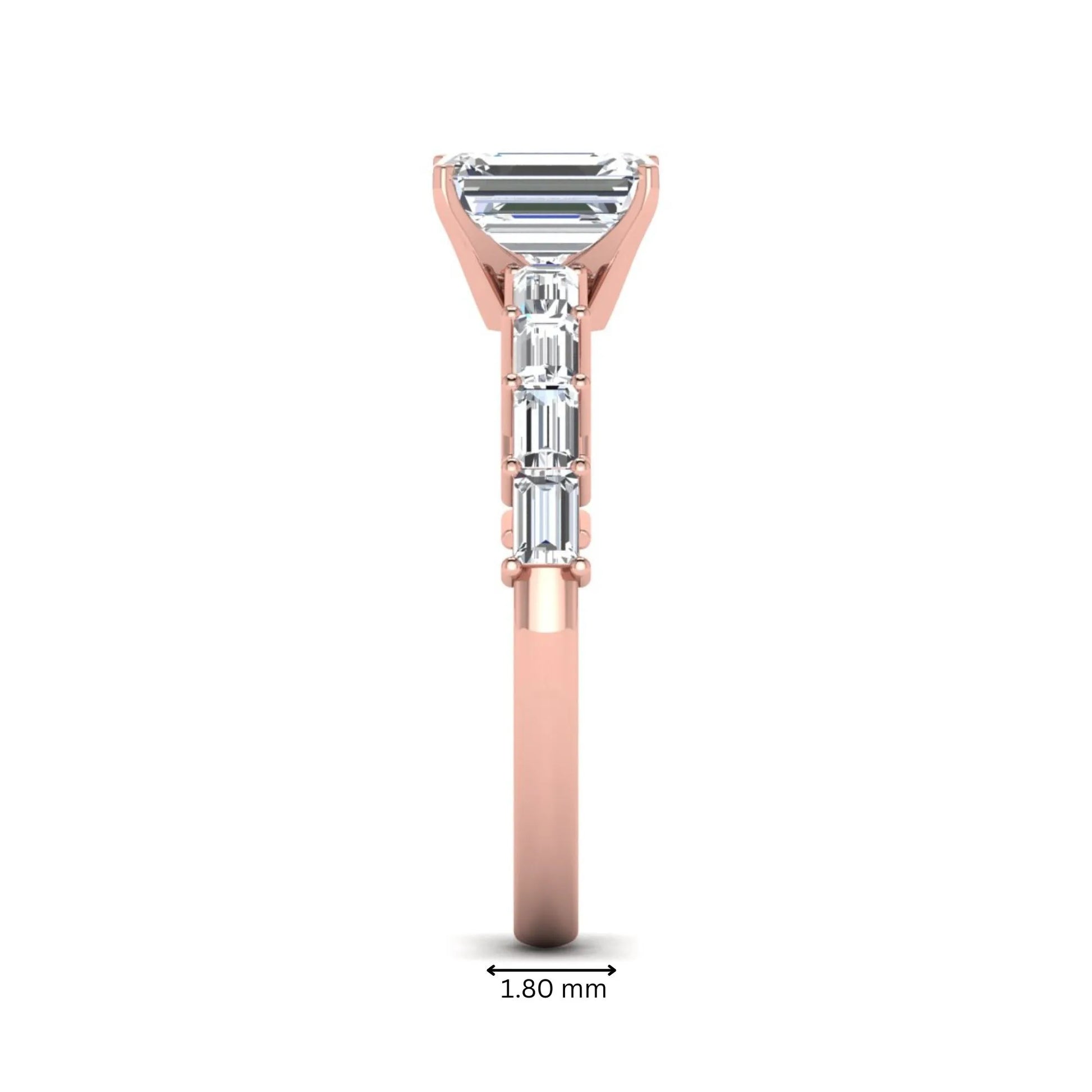 Emerald cut lab grown diamond engagement ring with baguette side diamonds in a four-prong solitaire accent setting and rose gold tone band.