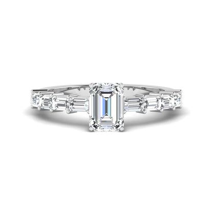 Emerald cut lab grown diamond engagement ring with baguette side diamonds in a four-prong solitaire accent setting and white gold tone band.