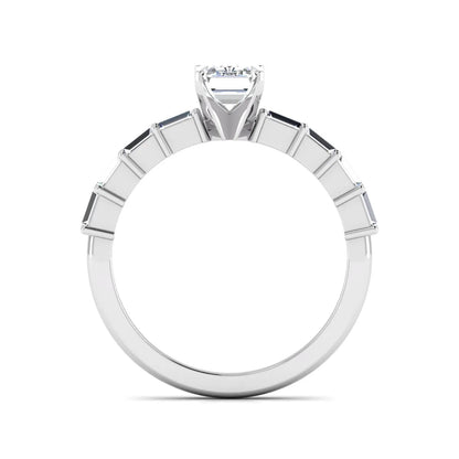 Emerald cut lab grown diamond engagement ring with baguette side diamonds in a four-prong solitaire accent setting and white gold tone band.