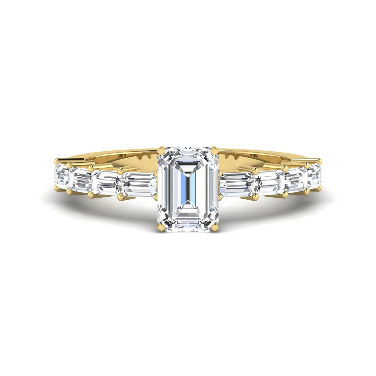 Emerald cut lab grown diamond engagement ring with baguette side diamonds in a four-prong solitaire accent setting and yellow gold tone band.