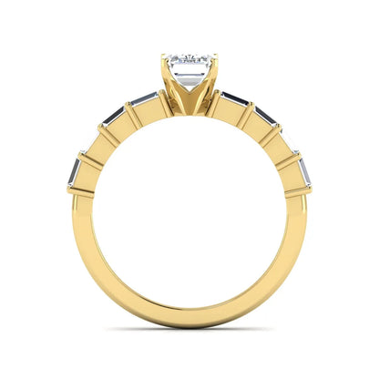 Emerald cut lab grown diamond engagement ring with baguette side diamonds in a four-prong solitaire accent setting and yellow gold tone band.