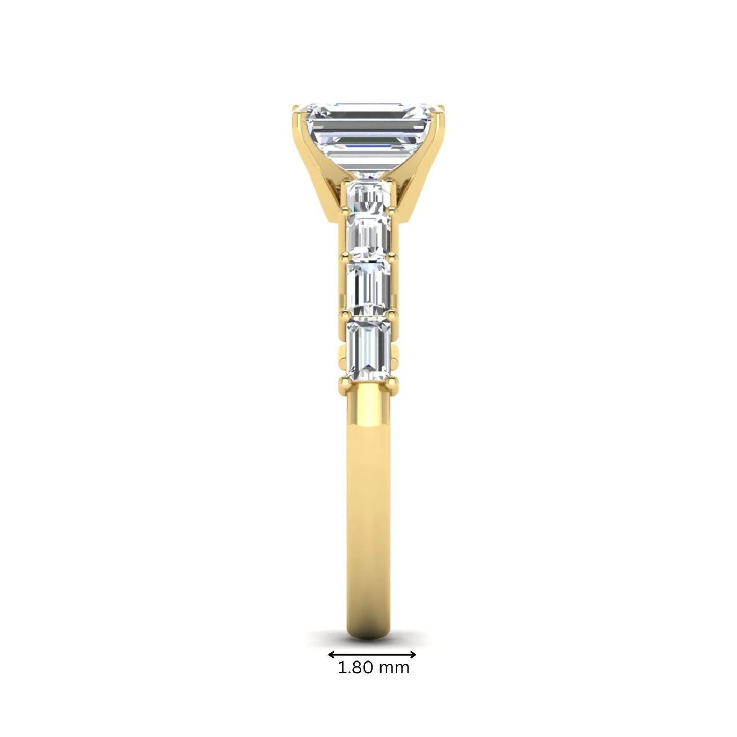 Emerald cut lab grown diamond engagement ring with baguette side diamonds in a four-prong solitaire accent setting and yellow gold tone band.