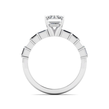 Emerald cut lab grown diamond engagement ring with baguette side diamonds in a four-prong solitaire accent setting and white gold tone band.