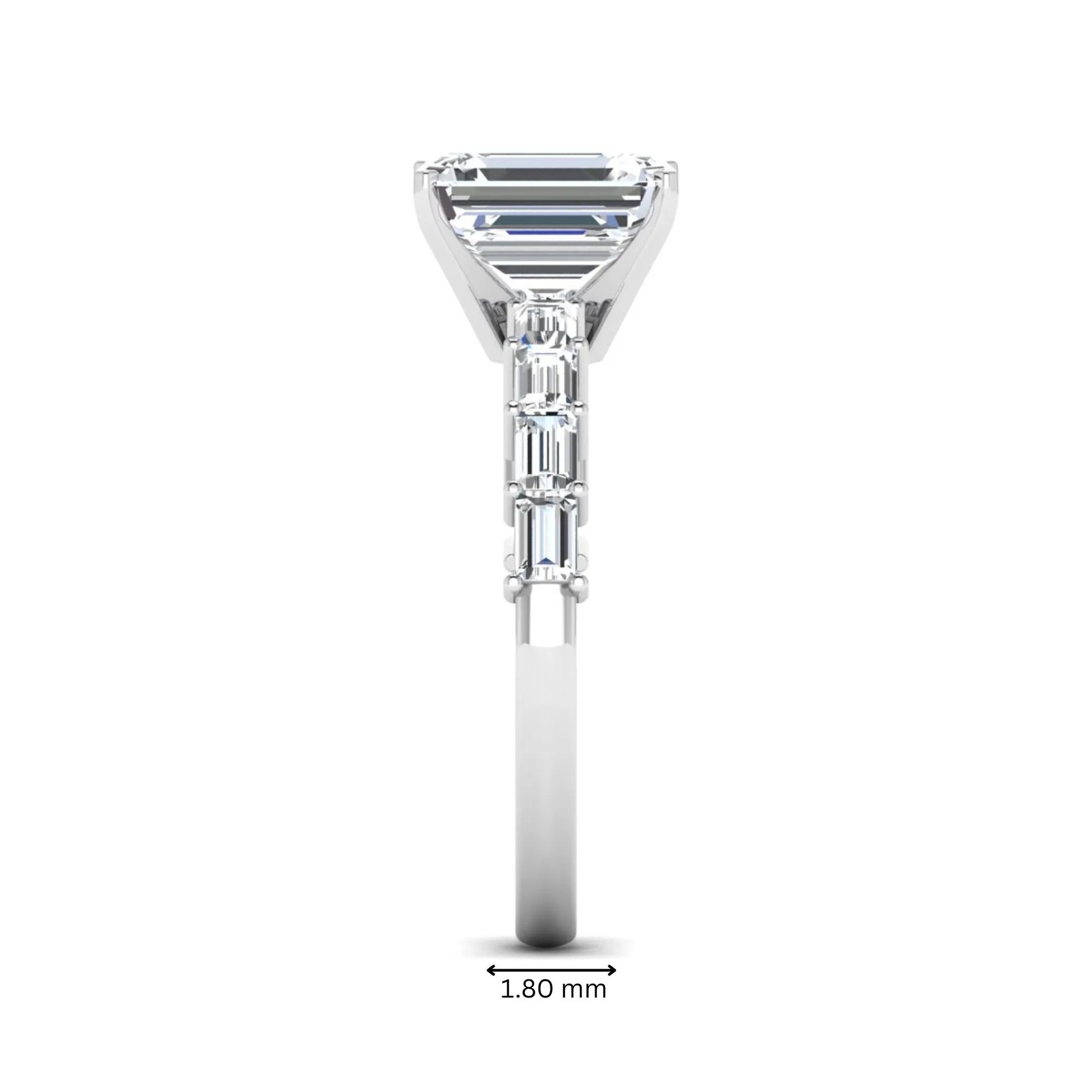 Emerald cut lab grown diamond engagement ring with baguette side diamonds in a four-prong solitaire accent setting and white gold tone band.