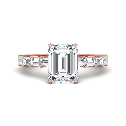 Emerald cut lab grown diamond engagement ring with baguette side diamonds in a four-prong solitaire accent setting and rose gold tone band.