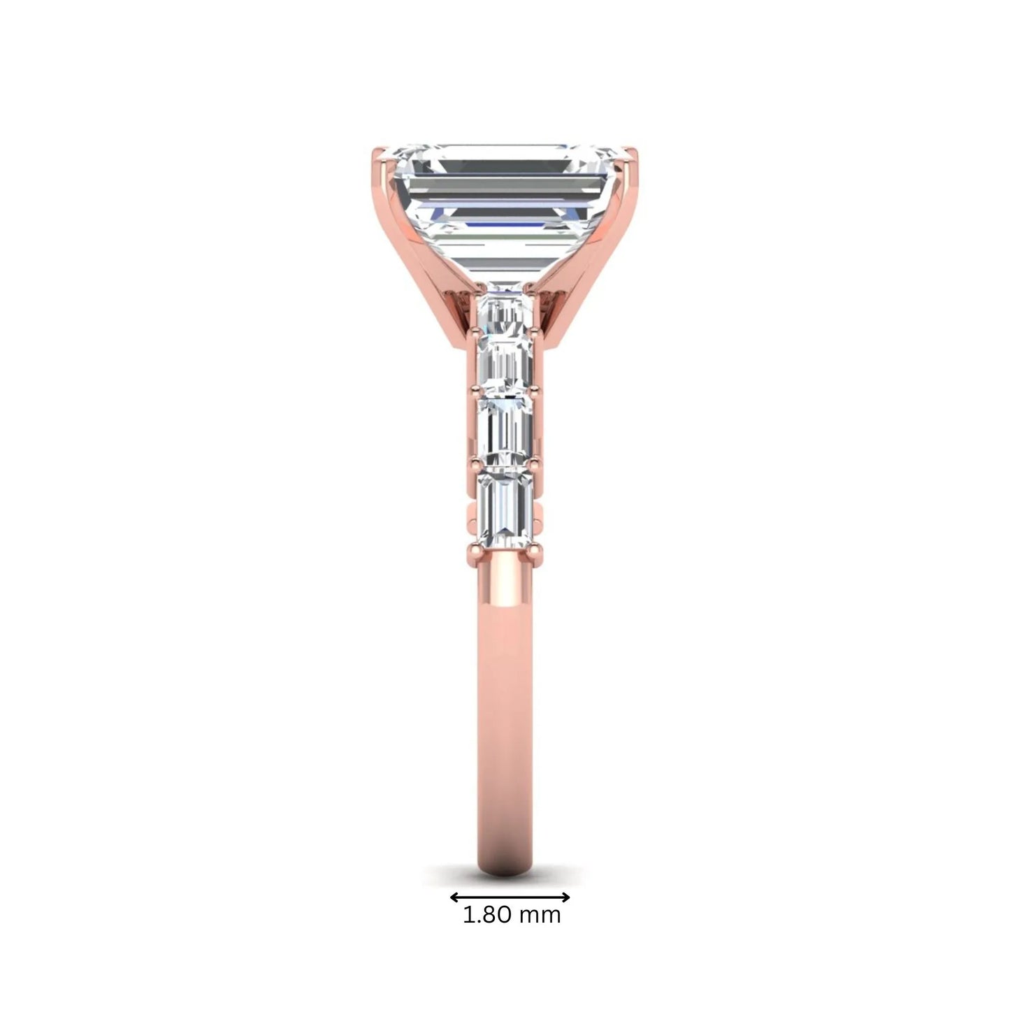 Emerald cut lab grown diamond engagement ring with baguette side diamonds in a four-prong solitaire accent setting and rose gold tone band.