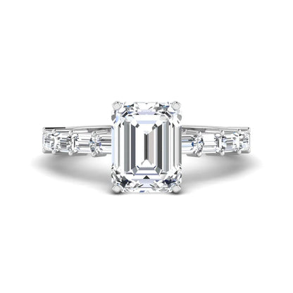 Emerald cut lab grown diamond engagement ring with baguette side diamonds in a four-prong solitaire accent setting and white gold tone band.