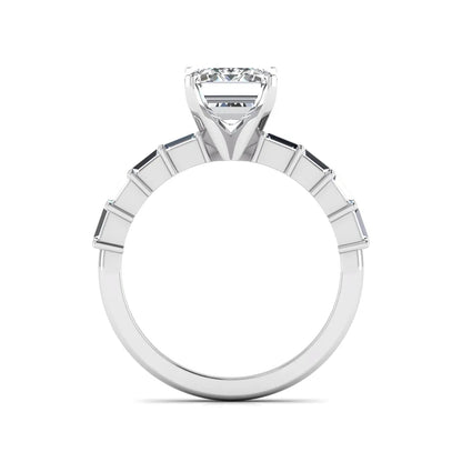 Emerald cut lab grown diamond engagement ring with baguette side diamonds in a four-prong solitaire accent setting and white gold tone band.
