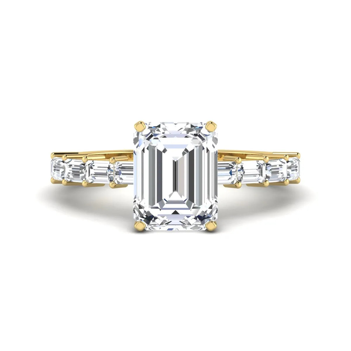 Emerald cut lab grown diamond engagement ring with baguette side diamonds in a four-prong solitaire accent setting and yellow gold tone band.