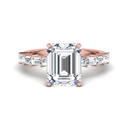 Emerald cut lab grown diamond engagement ring with baguette side diamonds in a four-prong solitaire accent setting and rose gold tone band.