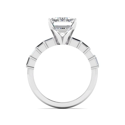 Emerald cut lab grown diamond engagement ring with baguette side diamonds in a four-prong solitaire accent setting and white gold tone band.