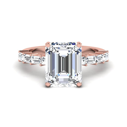 Emerald cut lab grown diamond engagement ring with baguette side diamonds in a four-prong solitaire accent setting and rose gold tone band.