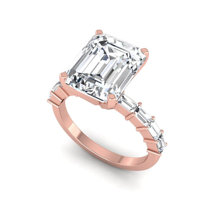 Emerald cut lab grown diamond engagement ring with baguette side diamonds in a four-prong solitaire accent setting and rose gold tone band.