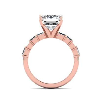 Emerald cut lab grown diamond engagement ring with baguette side diamonds in a four-prong solitaire accent setting and rose gold tone band.