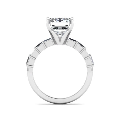 Emerald cut lab grown diamond engagement ring with baguette side diamonds in a four-prong solitaire accent setting and white gold tone band.
