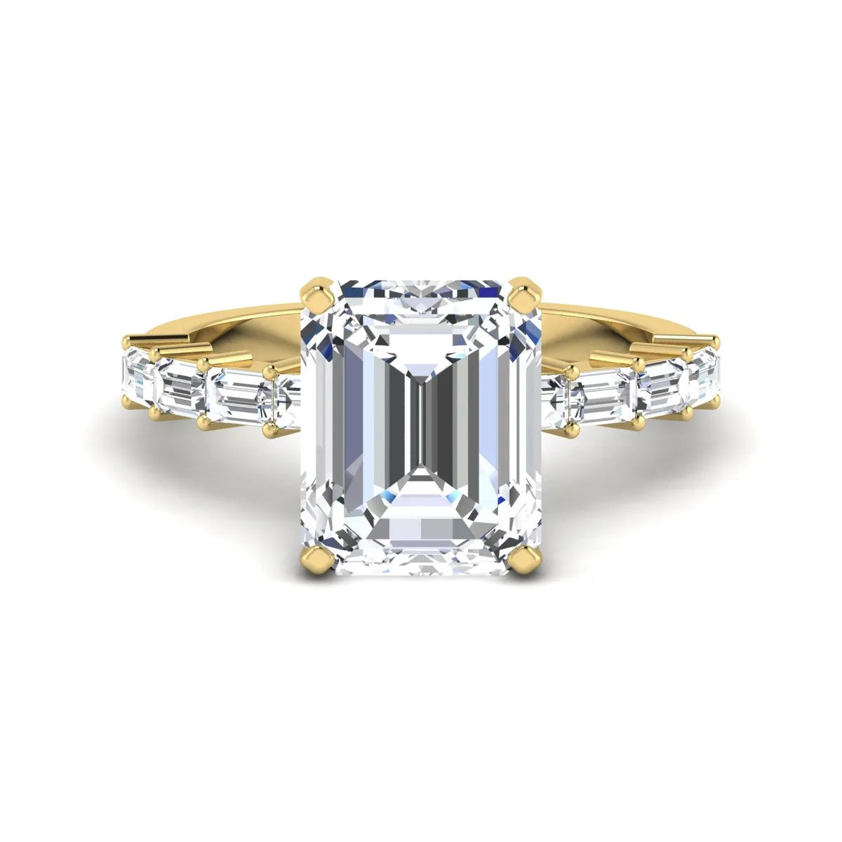 Emerald cut lab grown diamond engagement ring with baguette side diamonds in a four-prong solitaire accent setting and yellow gold tone band.