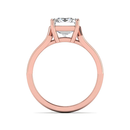Emerald cut lab grown diamond solitaire engagement ring featuring a four-prong cathedral setting with sculpted split cathedral shoulders in a rose gold finish.