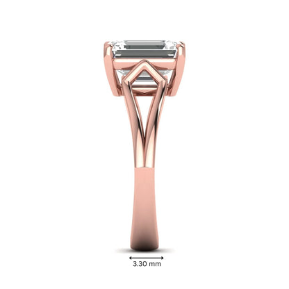 Emerald cut lab grown diamond solitaire engagement ring featuring a four-prong cathedral setting with sculpted split cathedral shoulders in a rose gold finish.