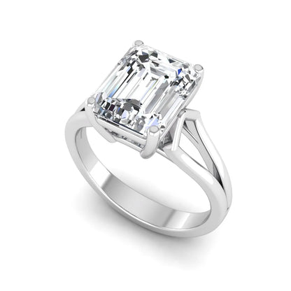 Emerald cut lab grown diamond solitaire engagement ring featuring a four-prong cathedral setting with sculpted split cathedral shoulders in a white gold finish.