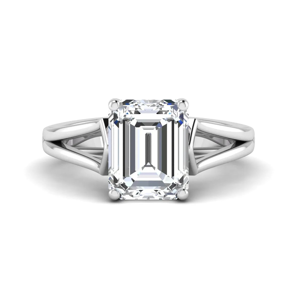 Emerald cut lab grown diamond solitaire engagement ring featuring a four-prong cathedral setting with sculpted split cathedral shoulders in a white gold finish.