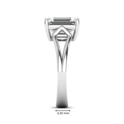 Emerald cut lab grown diamond solitaire engagement ring featuring a four-prong cathedral setting with sculpted split cathedral shoulders in a white gold finish.