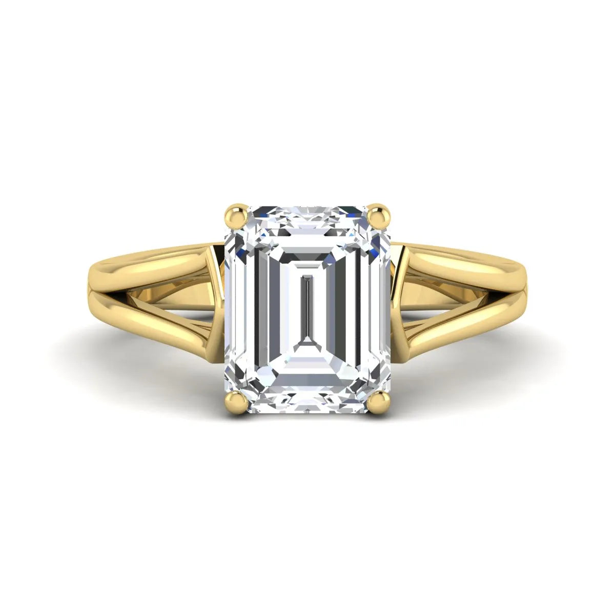 Emerald cut lab grown diamond solitaire engagement ring featuring a four-prong cathedral setting with sculpted split cathedral shoulders in a yellow gold finish.