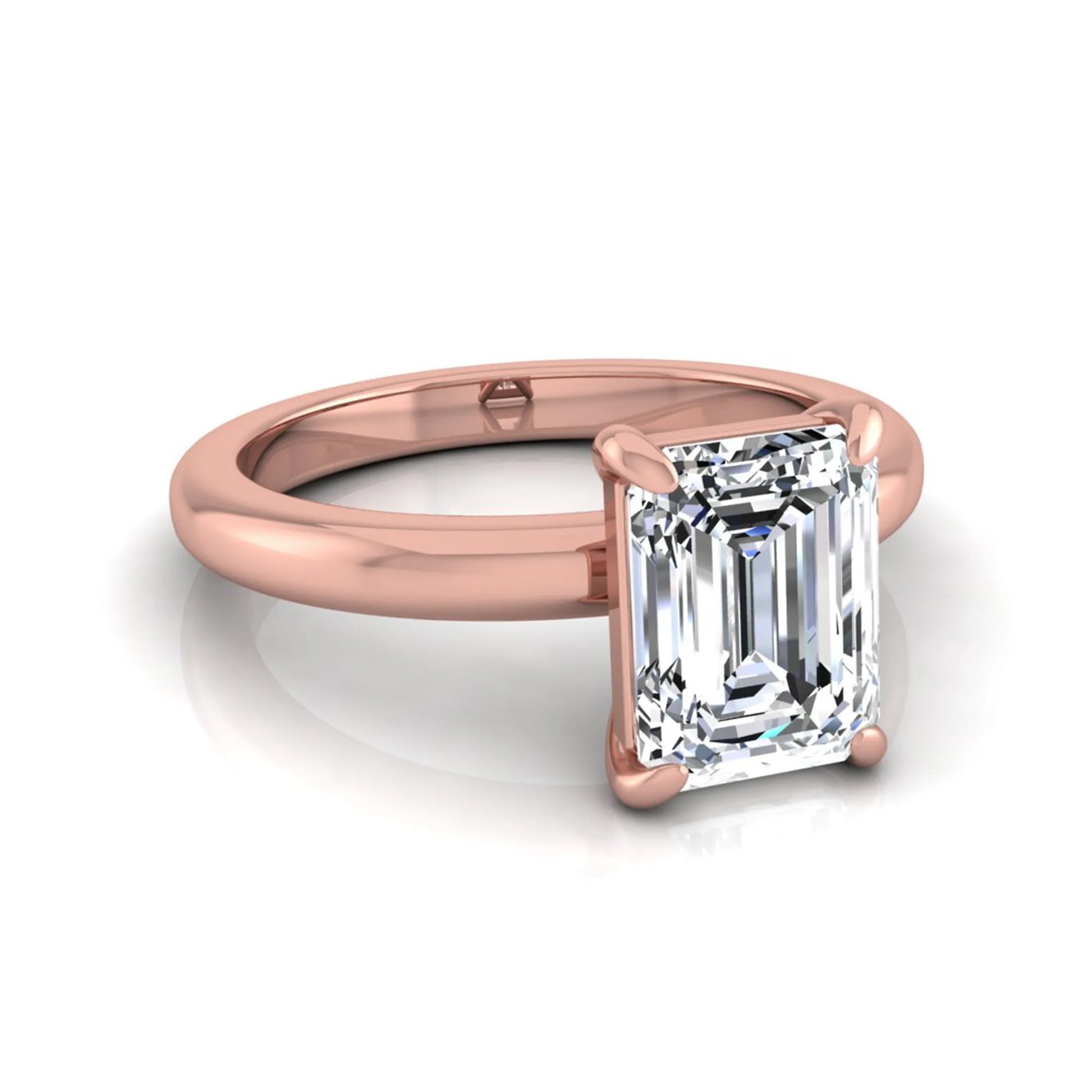 Emerald cut lab grown diamond solitaire engagement ring featuring an IGI certified center diamond in a classic four-prong setting with a polished band in rose gold