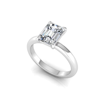 Emerald cut lab grown diamond solitaire engagement ring featuring an IGI certified center diamond in a classic four-prong setting with a polished band in white gold